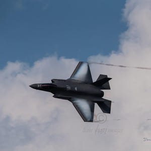 F-35 Lightning With Wing Vapor Metal Print