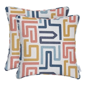 May include: Two square throw pillows with a geometric pattern in shades of blue, yellow, pink, and white. The pillows have a white background with a geometric pattern of lines and shapes in the colors mentioned. The pillows are made of a soft, textured fabric.