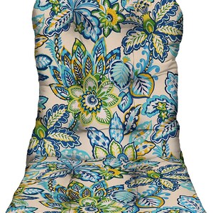 May include: A beige outdoor chair cushion with a vibrant floral pattern in shades of blue, green, and yellow. The cushion has a high back and a seat, designed for comfort and style. The floral design is detailed and eye-catching.