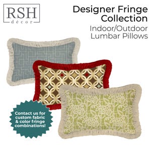 May include: Three rectangular lumbar pillows with fringe trim. One is blue with a geometric grid pattern and beige fringe. One is brown with a circular pattern and red fringe. One is light green with a floral pattern and beige fringe.