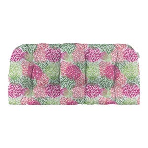 May include: A rectangular outdoor cushion with a floral pattern. The cushion features a white background with a repeating pattern of pink, green, and light pink flowers. The cushion is designed for comfort and style.