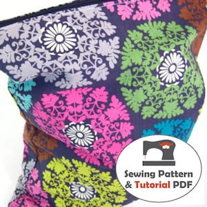 May include: A colorful fabric pouch with a floral pattern in shades of pink, green, blue, and white. The pouch has a zipper closure and a label that reads "Sewing Pattern & Tutorial PDF".