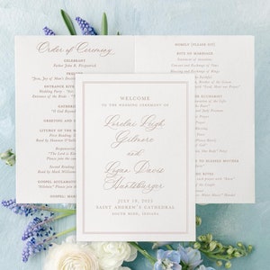 May include: Wedding ceremony program with a white background and brown text. The program lists the order of the ceremony, including the names of the bride and groom: Lorelai Leigh Gilmore and Logan Davis Huntzburger. The ceremony will take place on July 19, 2025, at Saint Andrew's Cathedral in South Bend, Indiana.