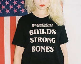 pussy BUILDS STRONG BONES | 70s Vintage Style Iron On Letter Saying Slogan Shirt Biker Humor Old Rock & Roll Boho Boner Punk Unisex T-Shirt