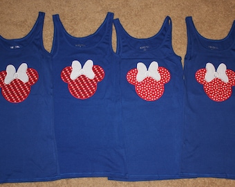 May include: Four blue tank tops with red and white embroidered Minnie Mouse designs.