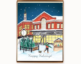 May include: A watercolor illustration of a winter scene with a red brick building, a clock tower, a Christmas tree lot, a cafe, and a maple syrup stand. The text "Happy Holidays!" is written in blue at the bottom of the image.