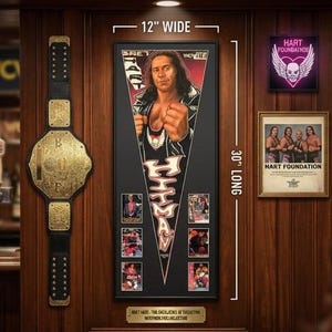 May include: A framed image of a wrestler, 30 inches long and 12 inches wide, with a championship belt and other memorabilia. The image features a wrestler in a black and white outfit. A neon sign and a framed photo are also visible.