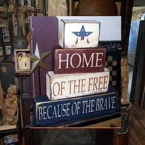 Hogar de los libres gracias a los valientes. Letrero de bloques primitivos.