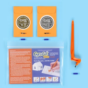 May include: A close-up of a Gyro-Cut Pro Combo craft tool kit. The kit includes a pen-like tool with a replaceable blade, two orange envelopes with blades, and a sheet of instructions. The instructions include the text "Gyro-Cut Pro Combo with Standard-Cut and Deep-Cut Blades. Works like a pen... cuts like a knife!"