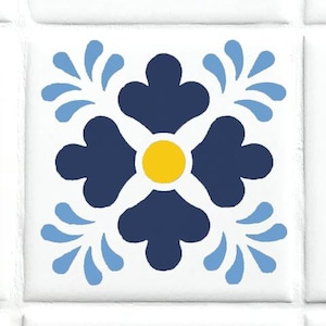 May include: A white tile with a blue and yellow floral design. The flower has four petals and a yellow center. The tile is surrounded by a white border.