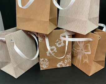 Extra small natural brown gift paper bags white print. x 10