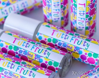 May include: A close-up of several small bottles of perfume oil labeled "Tutti Fruty" with a colorful polka dot pattern. The bottles are white with clear glass and have a roll-on applicator.