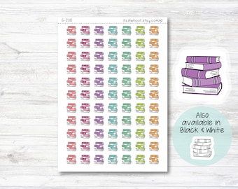 May include: A sheet of colorful stickers featuring stacks of books. The stickers are arranged in a grid pattern. The text "G-238" and "itsAwhoot.etsy.com" are printed at the top of the sheet. A larger sticker with a stack of books is shown in the upper right corner. A smaller sticker with a stack of books is shown in the lower right corner. The text "Also available in Black & White" is printed below the smaller sticker.