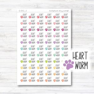 May include: A sheet of stickers with the words "HEART WORM" and paw prints in various colors. The stickers are arranged in a grid pattern. A separate sticker with the words "HEART WORM" and a purple paw print is also visible.