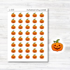 May include: A sheet of 36 orange and black Halloween pumpkin stickers. The stickers are arranged in a grid pattern. The text "L-010" and "itsAwhoot.etsy.com" is printed on the sheet.