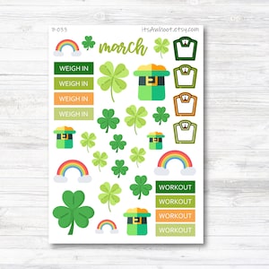 May include: A sheet of stickers featuring a variety of St. Patrick's Day themed designs, including shamrocks, rainbows, leprechaun hats, and scales. The sheet also includes the word "march" and the phrase "weigh in" repeated four times. The sheet also includes the word "workout" repeated four times.