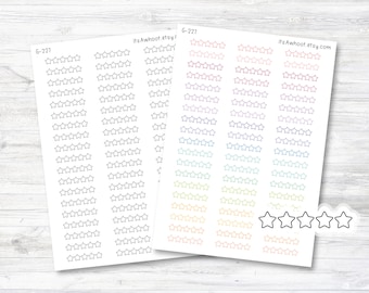 May include: A sheet of colorful star stickers with a variety of colors including pink, purple, blue, green, yellow, and orange. The sheet also includes a row of black and white star stickers.