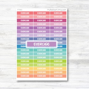 May include: A sheet of colorful stickers with the word "EXERCISE" printed on each sticker. The stickers are arranged in rows and columns, with each row featuring a different color.
