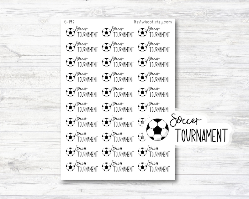 May include: A sheet of 24 black and white soccer ball stickers with the text "Soccer Tournament" on each sticker. The sheet also includes a larger sticker with the text "Soccer Tournament".