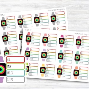 May include: A set of 20 colorful printable stickers for a fitness tracker. Each sticker features a black and white smartwatch icon with a colorful ring around the face. The stickers are labeled with "CAL", "MIN", "MILES", and "STEPS".