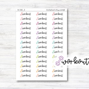 May include: A sheet of colorful stickers with the word "workout" and a dumbbell icon. The stickers are in various pastel colors, including pink, blue, green, yellow, and orange. The sheet is on a white wooden background.