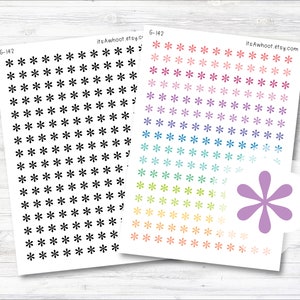 May include: Two sheets of stickers with a rainbow of colors. The stickers are small and feature a starburst design. The stickers are perfect for planners, journals, and other craft projects.