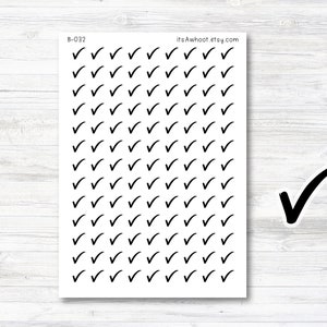 May include: A sheet of black checkmark stickers with the text "B-032" and "itsAwhoot.etsy.com" printed at the top. The sheet is on a white wood background.