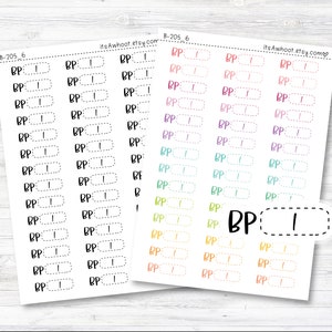 May include: A sheet of printable stickers with a rainbow gradient of colors. The stickers are designed for a bullet journal or planner and feature the text "BP" with a blank space for writing in blood pressure readings.