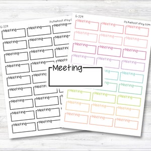 May include: Two sheets of planner stickers with the word "Meeting" printed on them. One sheet is black and white, the other has colorful boxes. The stickers are rectangular with a space for writing.
