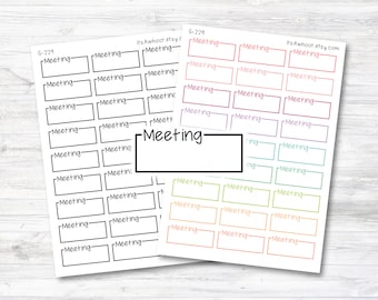 May include: Two sheets of planner stickers with the word "Meeting" printed on them. One sheet is black and white, the other has colorful boxes. The stickers are rectangular with a space for writing.