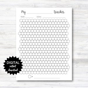 May include: Printable digital download of a black and white honeycomb tracker with the text "My tracker" at the top. The tracker has spaces for a year and goal.
