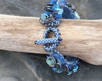 Rose Petal Bracelet;  Hand Woven Czech Glass Iridescent Blue & Blue-Green Rose Petals with Peridot Gemstones and Miyuki Beads