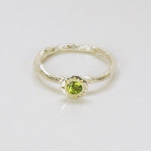 A Peridot Ring In A Rustic Sterling Silver Setting