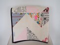 Pink, black and white handmade baby quilt with back in a patchwork of three beautiful fabrics product logo