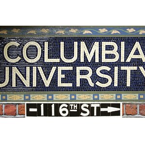 May include: A blue and white mosaic tile sign with the text "COLUMBIA UNIVERSITY" in white letters. Below the sign is a black and white sign with the text "116TH ST" and an arrow pointing to the right.