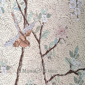 May include: A mosaic tile artwork depicting a bird perched on a branch with white flowers and green leaves. The background is a light beige color.
