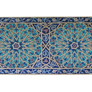 May include: A blue and white mosaic tile with a geometric pattern. The tile features a repeating design of stars and flowers.