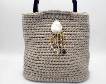 Beige Crochet Bag with handles and hard bottom and Leather/Shell embellishment