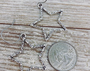 Matte silver star earrings on stainless steel ear wires