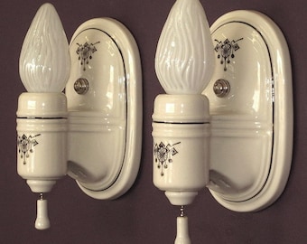 White Porcelain Sconce with Black Art Deco Design Priced per pair.