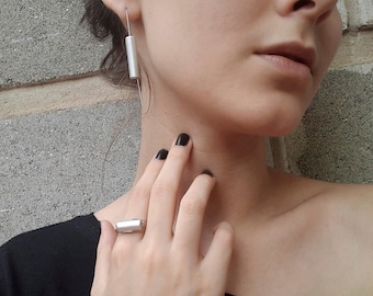 Contemporary jewelry set, earrings and ring. Elegant, geometrical, minimalist and modern.