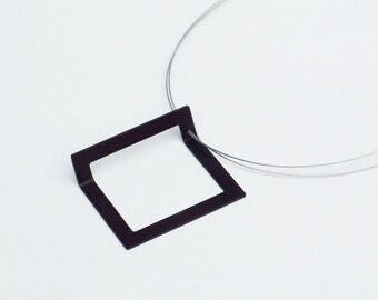 Geometric jewelry: square pendant. Architectural inspiration, minimalist design jewelry. Bauhaus style contemporary jewelry