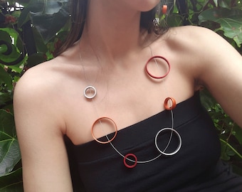 Aluminum jewelry, Earth & Moon necklace. Geometric, contemporary, minimalist and architectural jewelry.