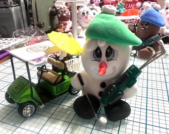 Green golf cart golfer