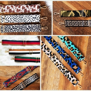 May include: Assortment of colorful and patterned adjustable straps for bags. The straps feature various designs, including animal prints, geometric patterns, and stripes. The straps are made of durable fabric and have gold-toned metal hardware.