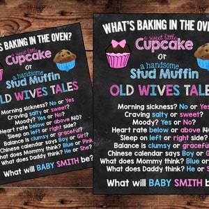 May include: A black chalkboard sign with the text "What's Baking in the Oven?" and a pink cupcake and a blue muffin. The sign also includes the text "Old Wives Tales" and a list of questions to determine the gender of a baby.
