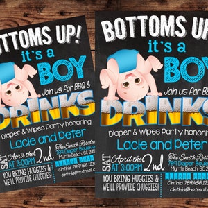 May include: Two baby shower invitations on a wooden background. The invitations have a black chalkboard style background with the text "BOTTOMS UP! it's a BOY" and a cartoon baby. The invitations also include event details.