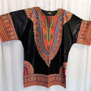 African Black Dashiki brocade fabric matching Kufi Print, sold separately.