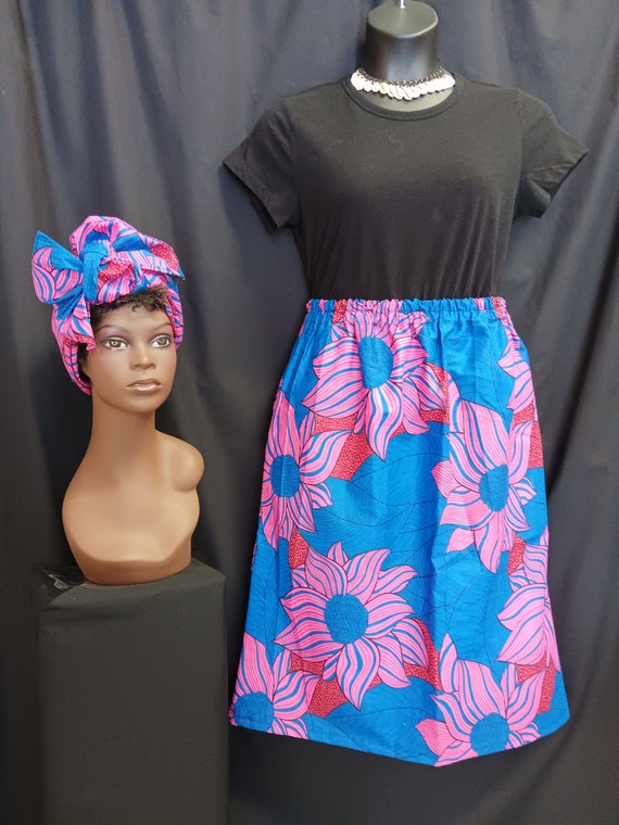 African Print straight Skirt with head wrap. Print colors are blue, pink, black, and red. Below knee length. 100% Cotton. Free Shipping