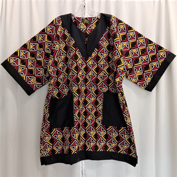 African print fabric black, red, yellow, white dashiki, trimmed in black, beautiful print (matching Kufi sold  separately.)